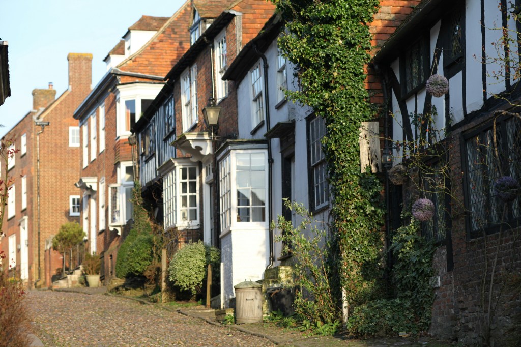 A steep road lined with historic buildings in Rye.