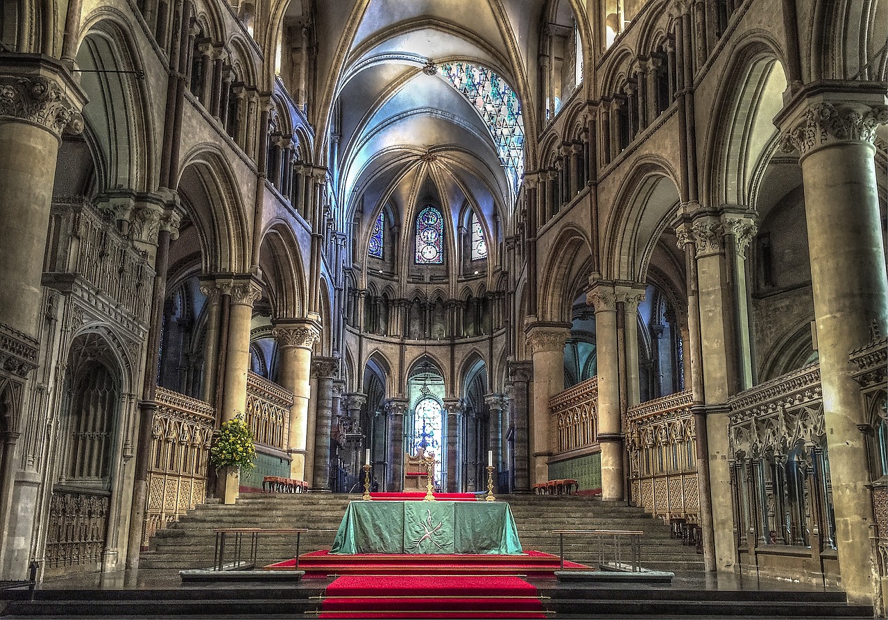 The inside of a Canterbury cathedral, ornate stone.
