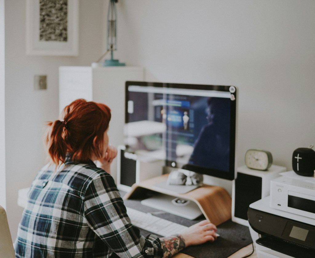 A woman sitting at her desk