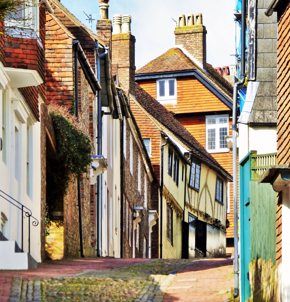 A steep street with historic buildings