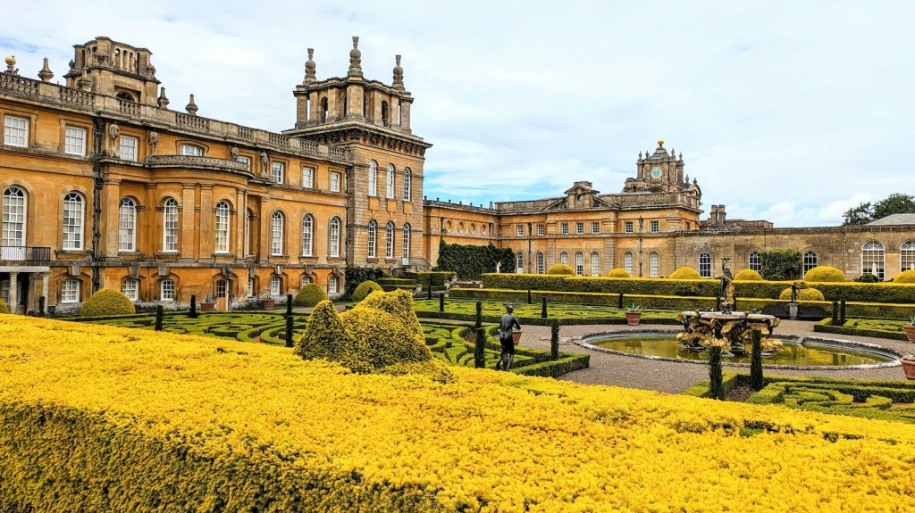 A view of Blenheim Palace which is made of honey coloured stone.